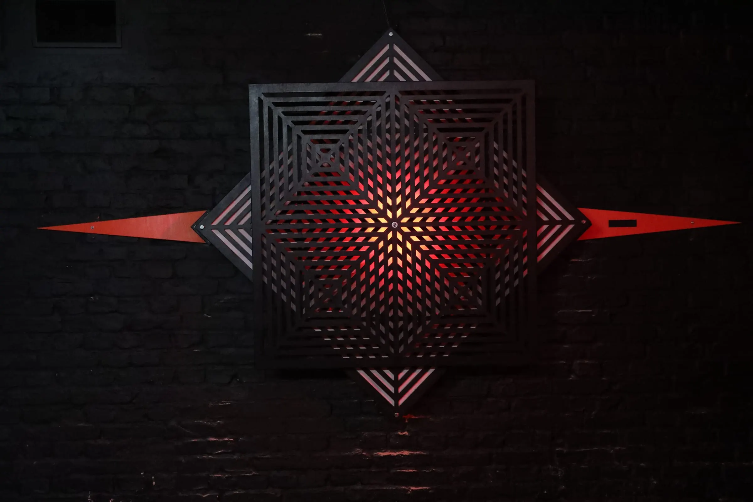 Red Diamond – Only straight lines – though you see curves. A wall piece of layered, rotating frames.