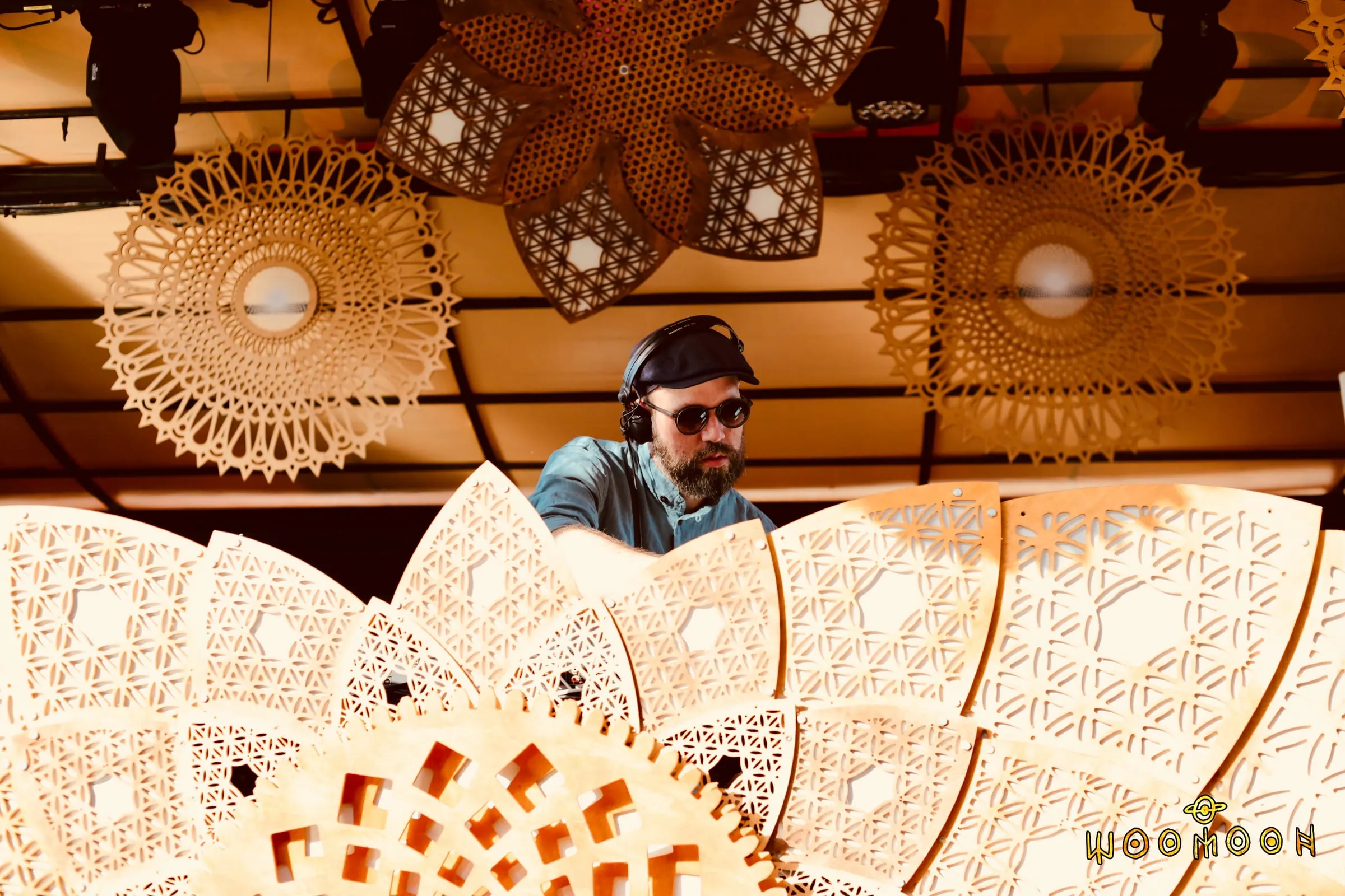 Woomoon – Wooden kinetic stage worlds for Woomoon × Cova Santa in Ibiza and Papaya Playa in Tulum – intricate geometry that turns into light at night.