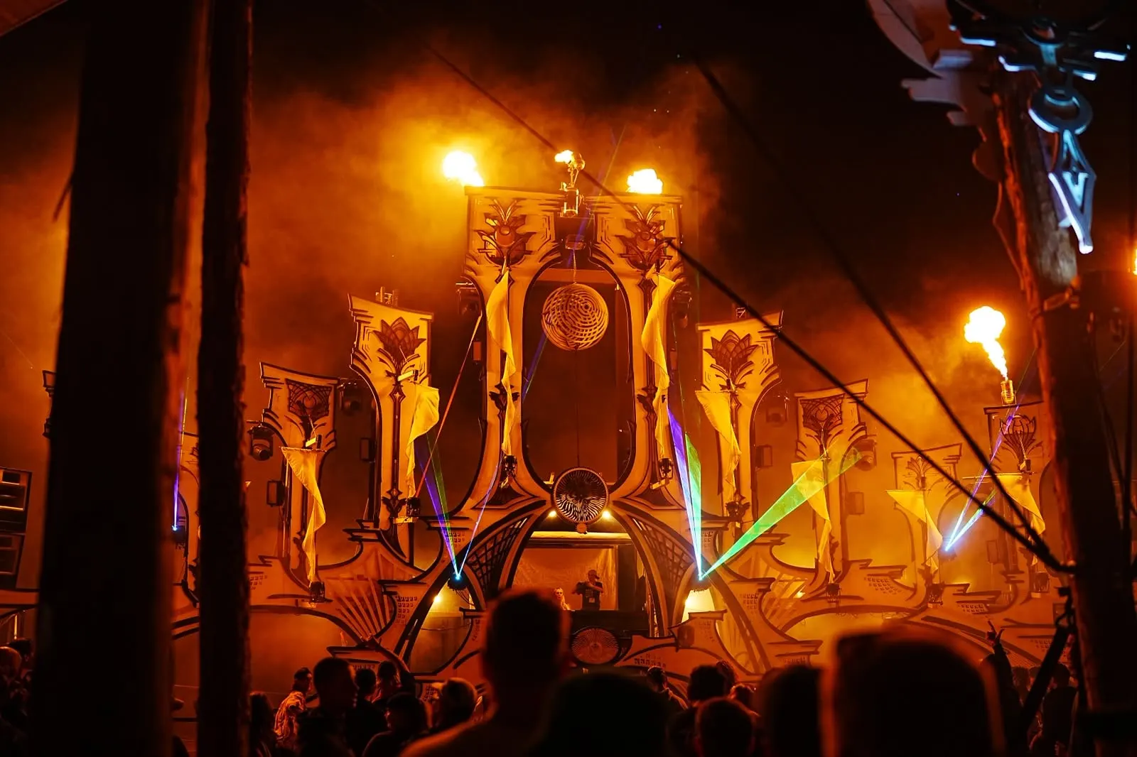 Feel Festival · Beach Stage 2026 – The 2026 beach stage – a temple of ornamental pillars, flowing drapes and fire, planned as one machine from the substructure up.